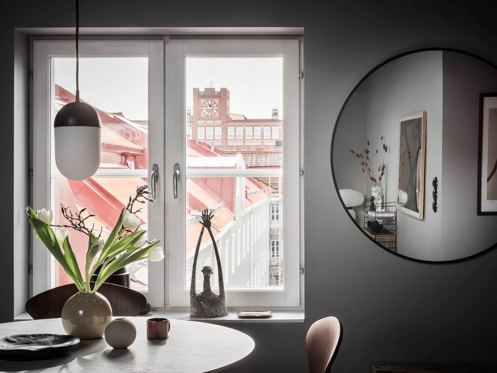 large-round-mirror-gray-attic-apartment-nordroom