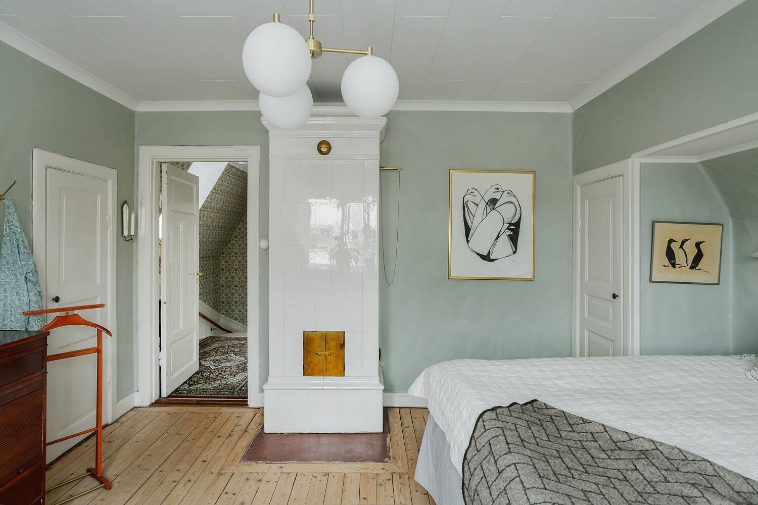 master-bedroom-light-green-walls-tiled-fireplace-nordroom
