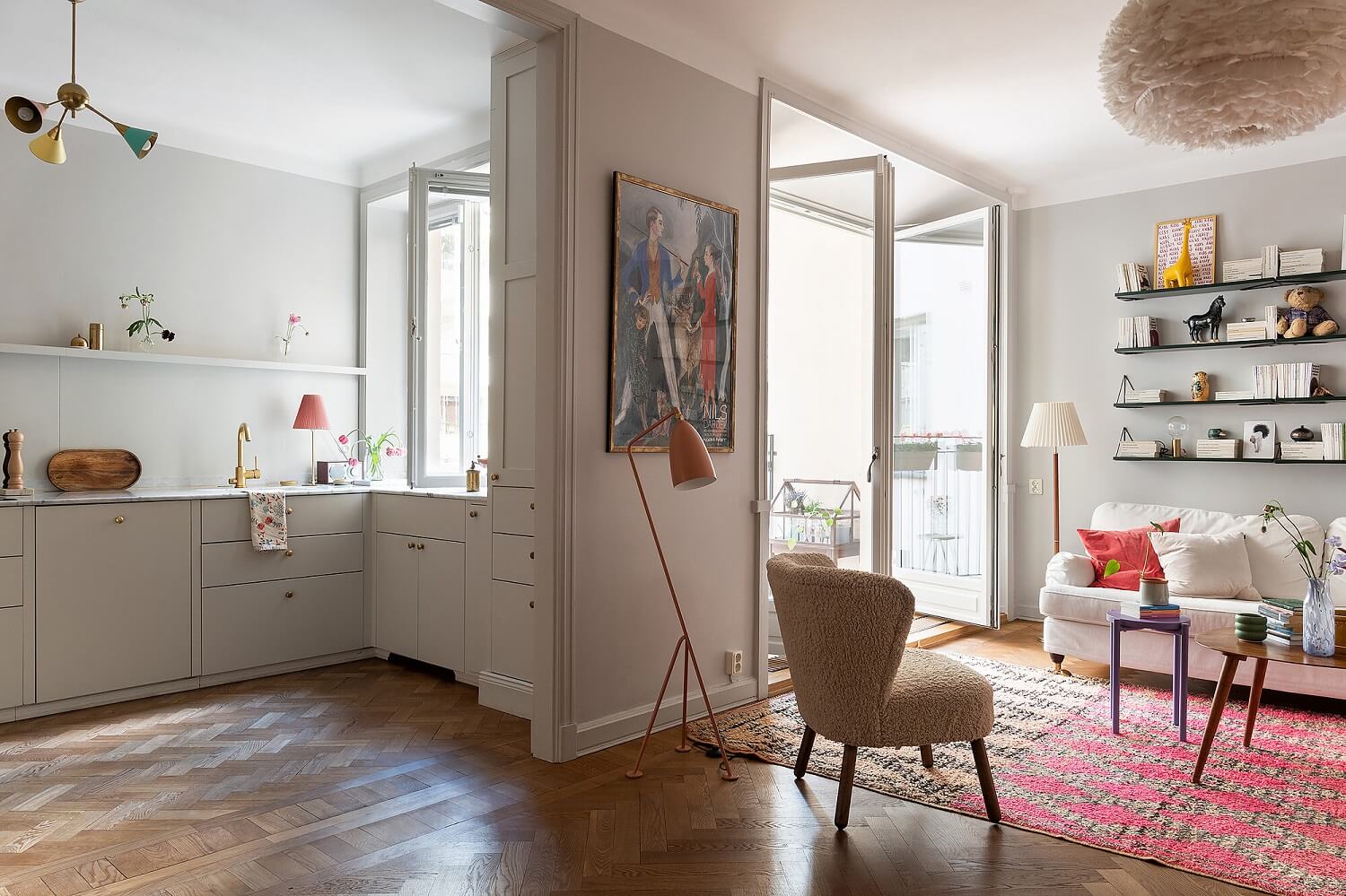 open-plan-living-room-kitchen-wooden-floorboards-pink-rug-nordroom