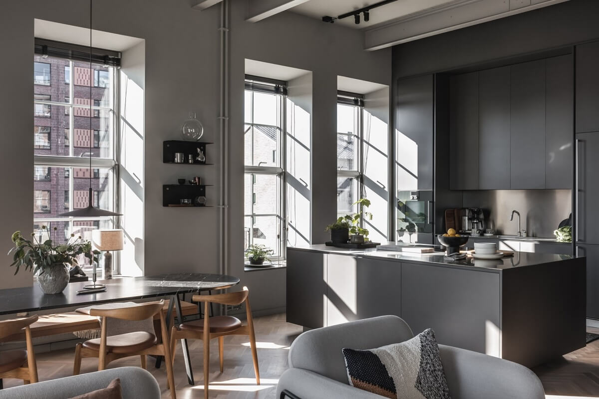 A Modern Gray Industrial Apartment 1 open-plan-living-space-gray-kitchen-natural-light-nordroom