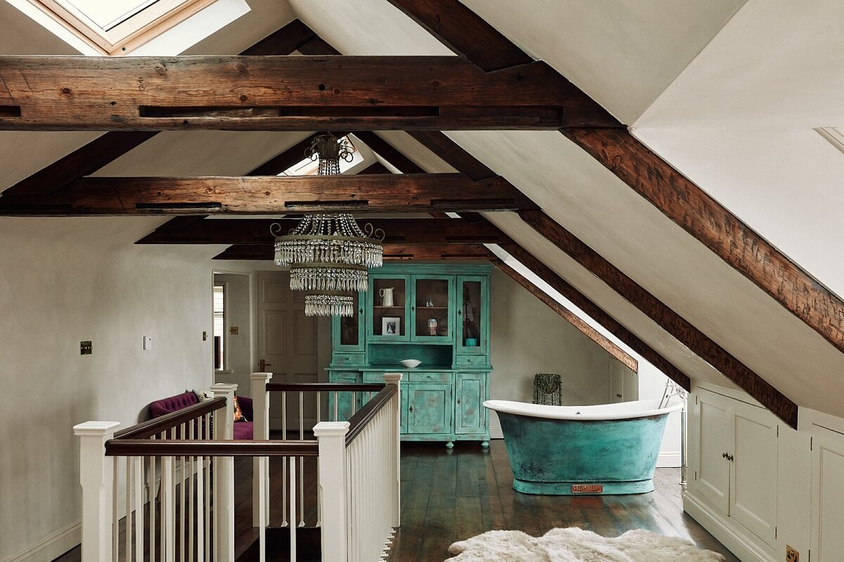 attic-suite-exposed-wooden-beams-freestanding-bath-blue-vintage-cabinet-nordroom