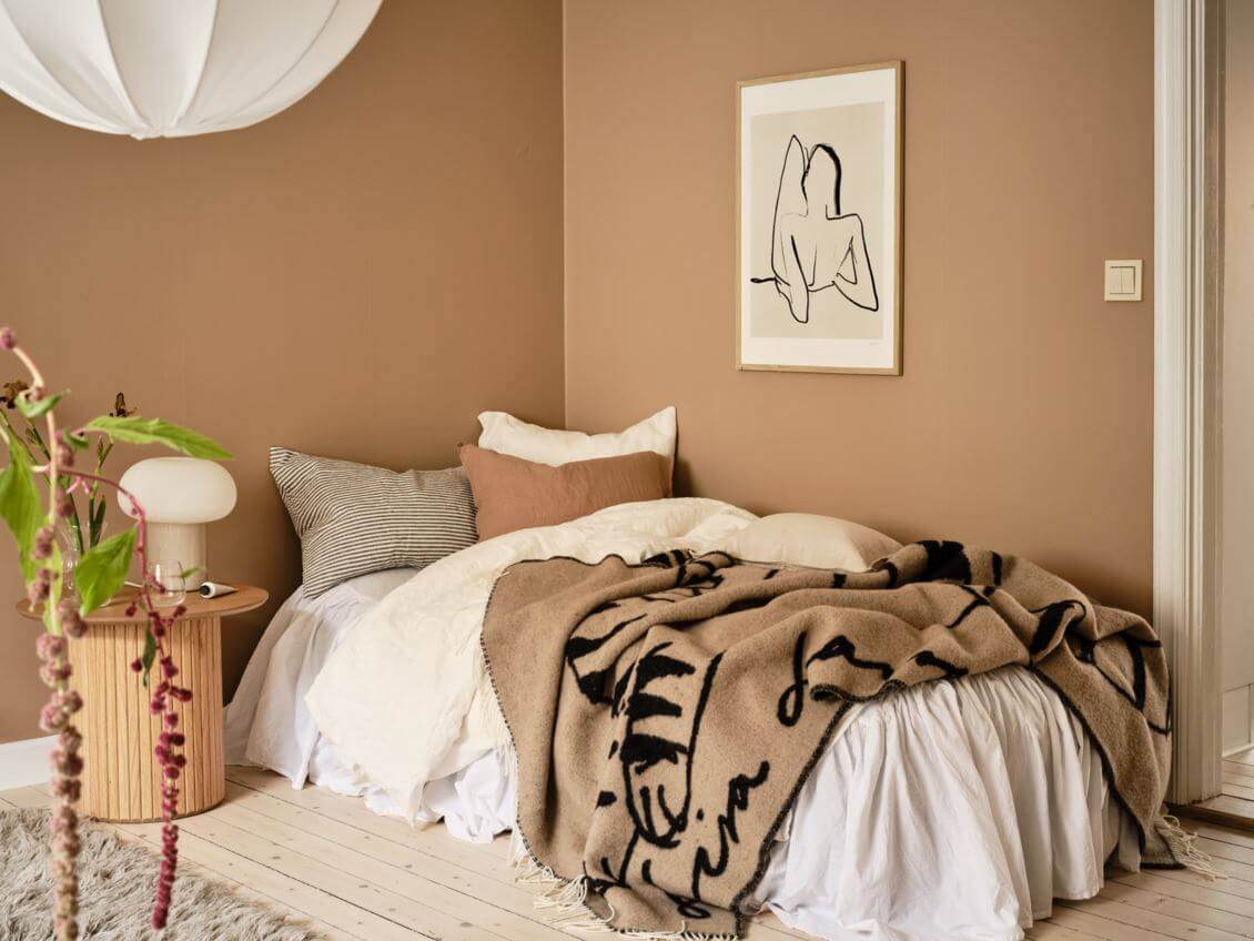 bed-area-studio-apartment-warm-beige-walls-nordroom