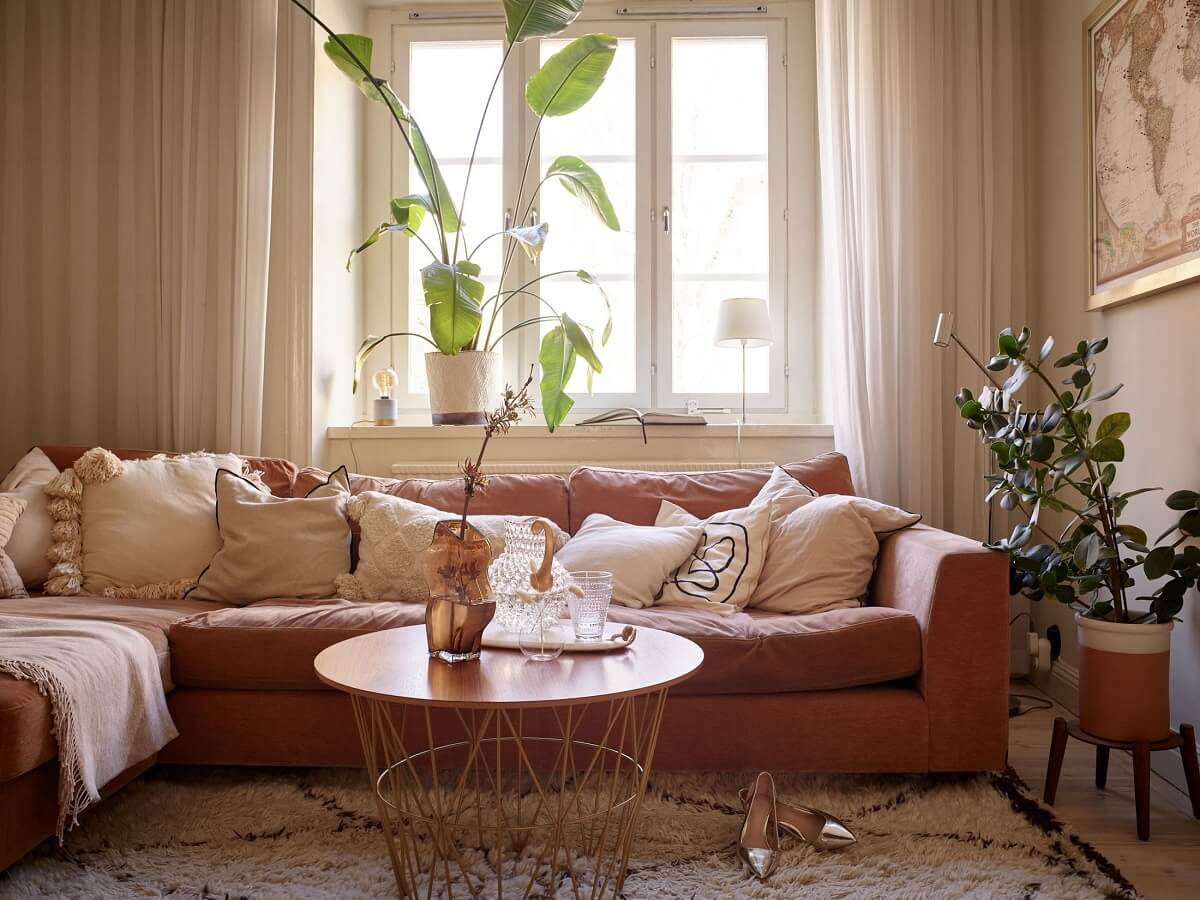 beige-apartment-orange-red-sofa-cushions-nordroom