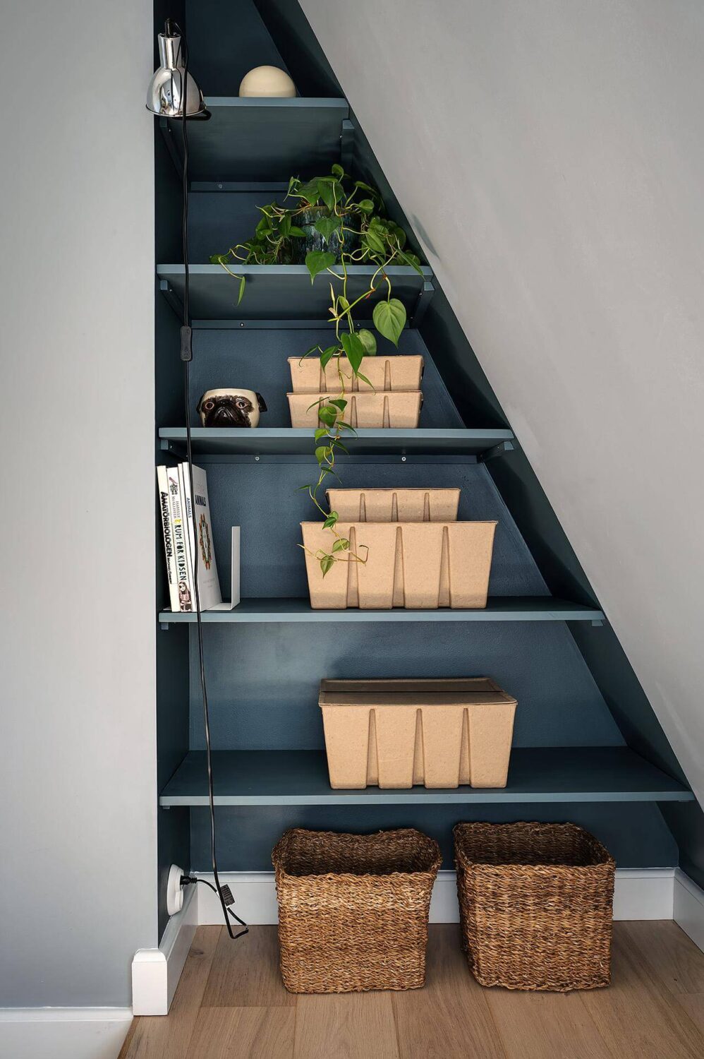 blue-painted-built-in-shelves-slanted-ceiling-nordroom