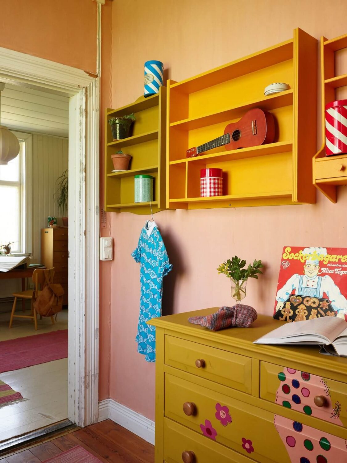 colorful-kids-room-pink-walls-yellow-dresser-nordroom