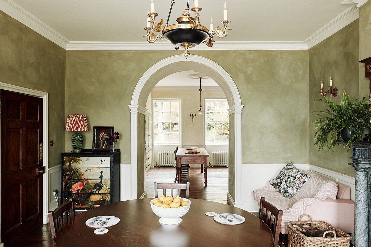 dining-room-arched-doorway-kitchen-green-walls-nordroom