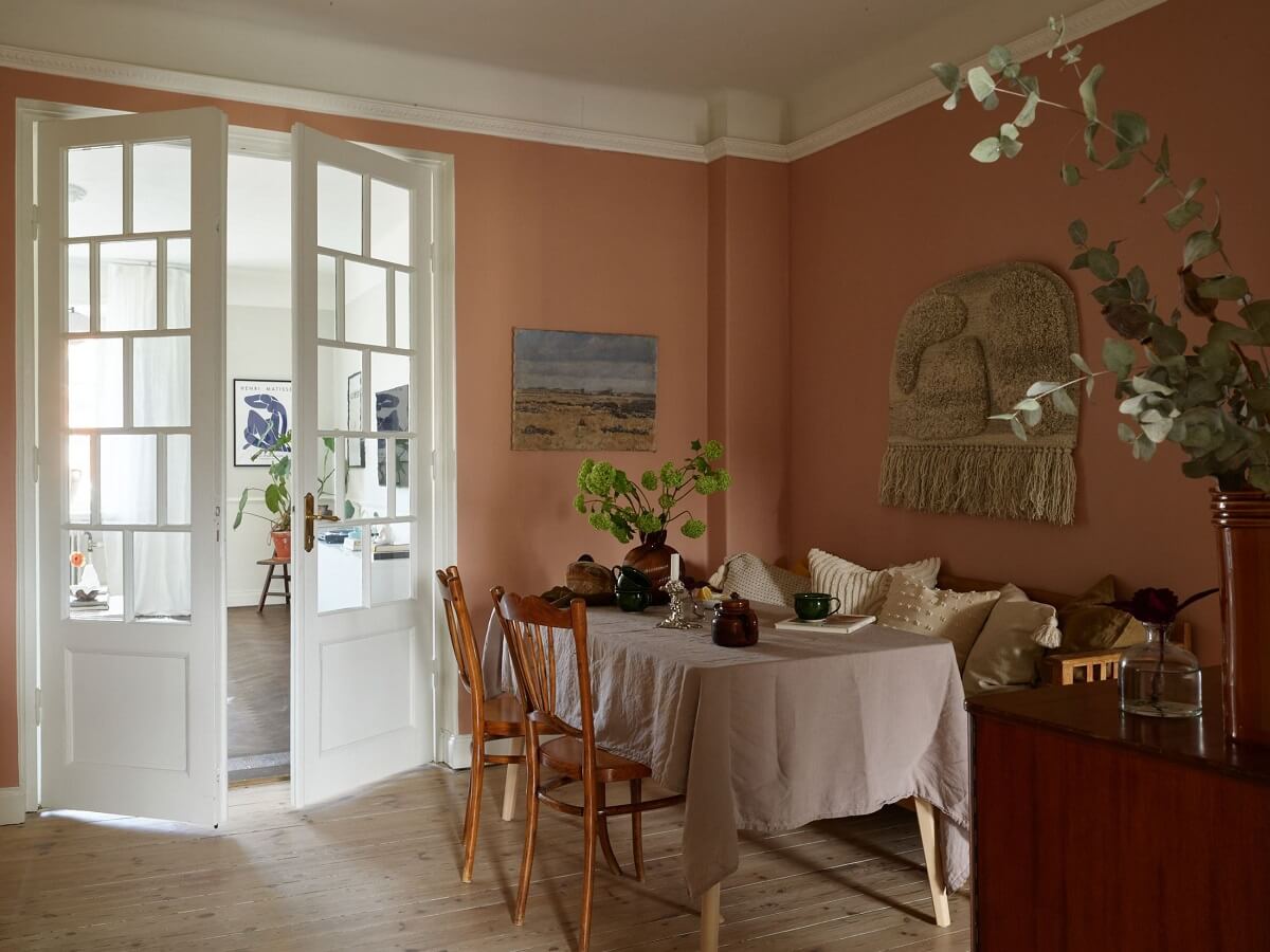 A Scandinavian Apartment with a Light Green Bedroom