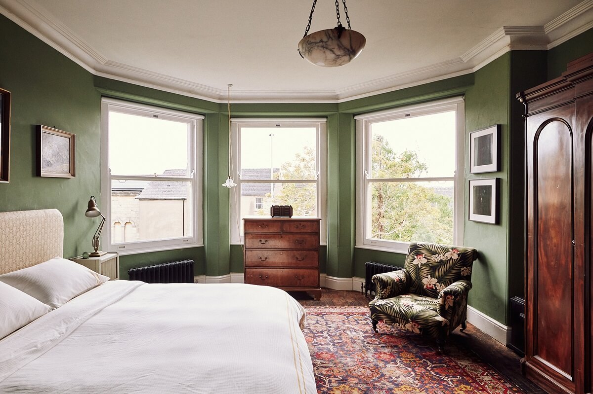 green-bedroom-antique-wardrobe-large-rug-bay-window-nordroom