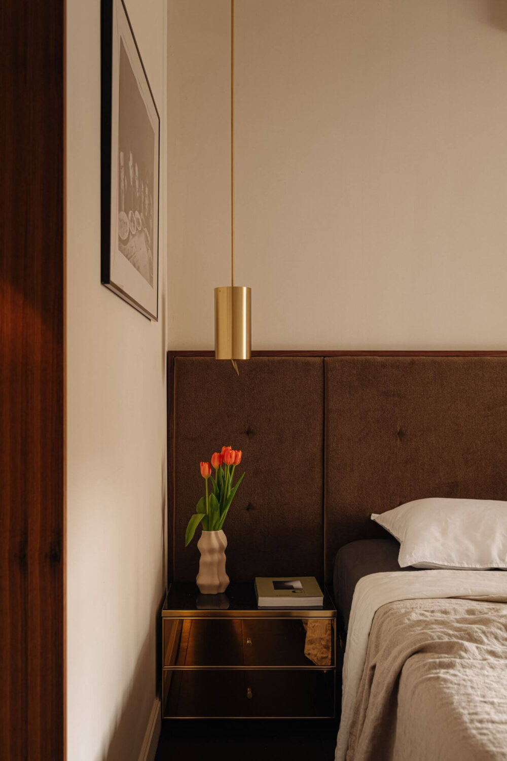 hotel-style-bedroom-textured-headboard-gold-nightstand-nordroom