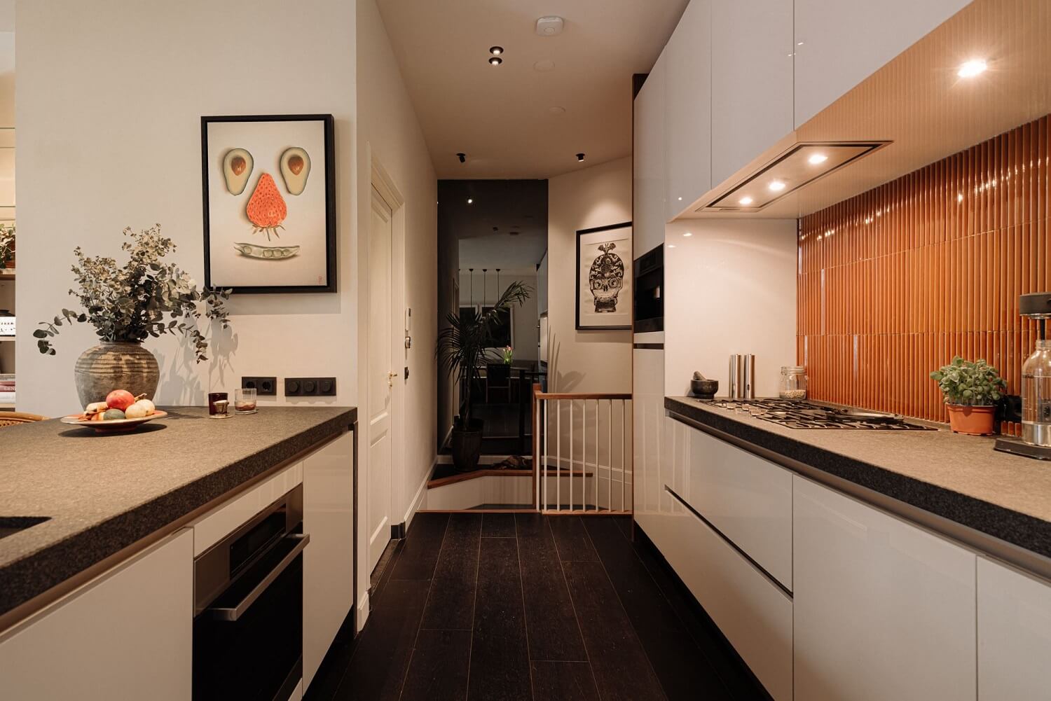 modern-galley-kitchen-white-cabients-textured-orange-backsplash-nordroom