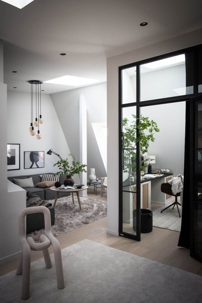 open-plan-attic-apartment-industrial-elements-glass-steel-door-home-office-nordroom