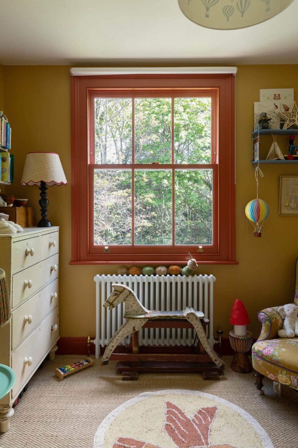 orange-red-window-frame-ochre-yellow-walls-nursery-nordroom