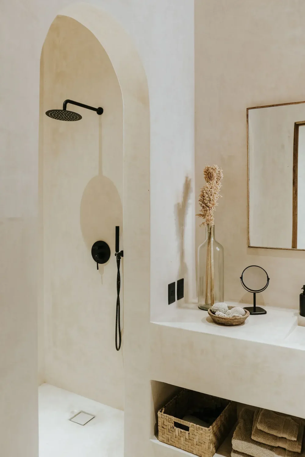 serene-bathroom-walk-in-shower-arched-doorway-black-fittings-nordroom
