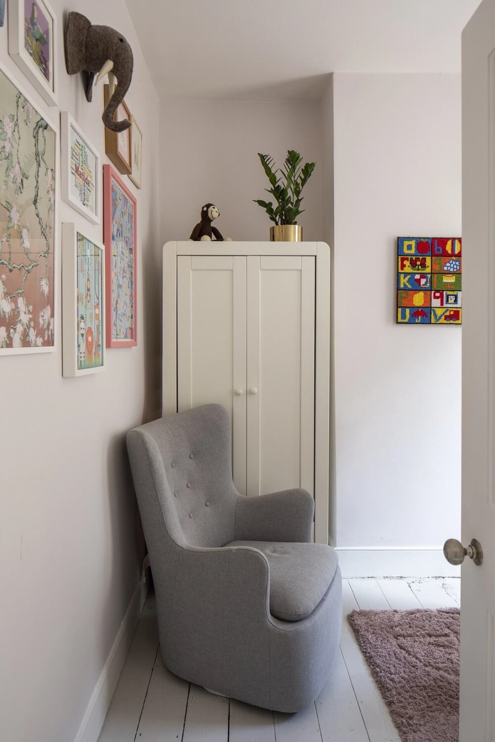 small-white-baby-room-gray-chair-nordroom