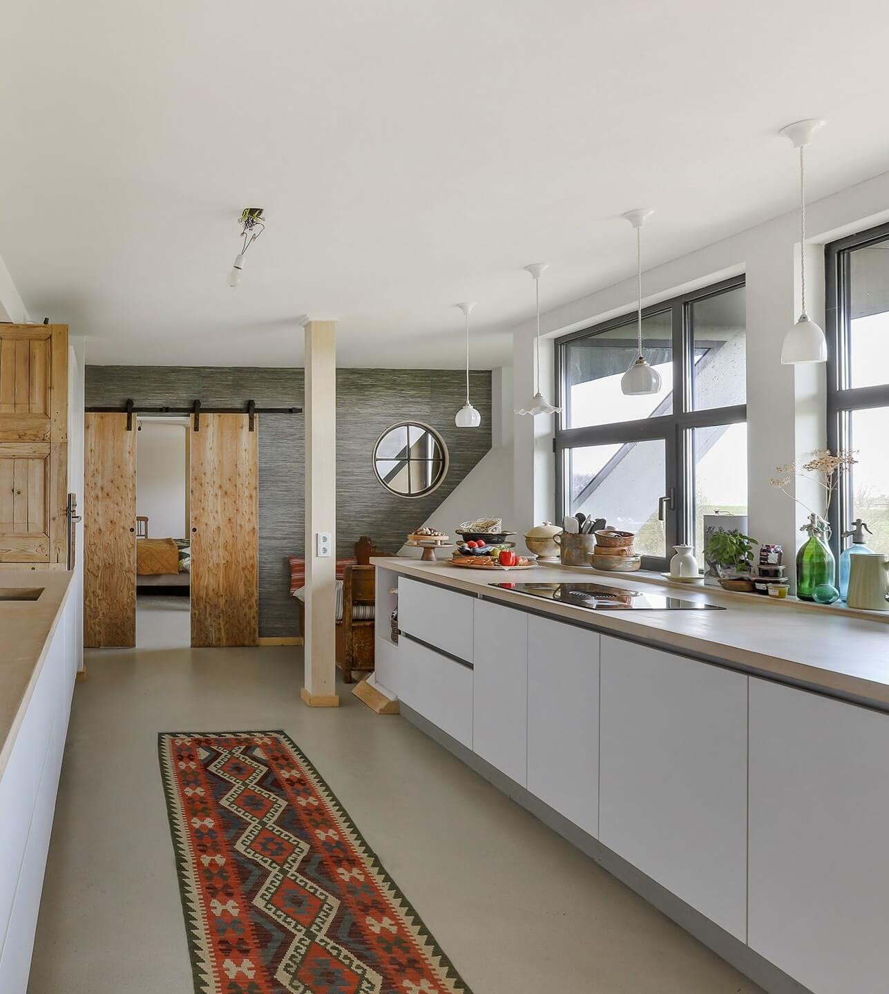 white-modern-galley-kitchen-sliding-wooden-doors-nordroom