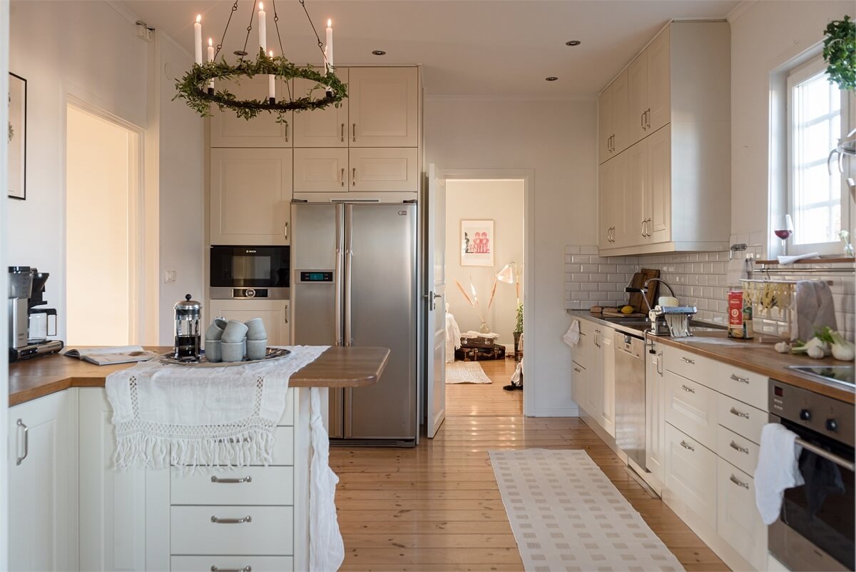 kitchen-white-cabinets-wooden-floorboards-nordroom