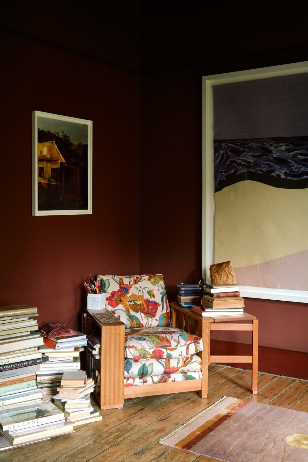living-room-deep-red-walls-large-artwork-nordroom