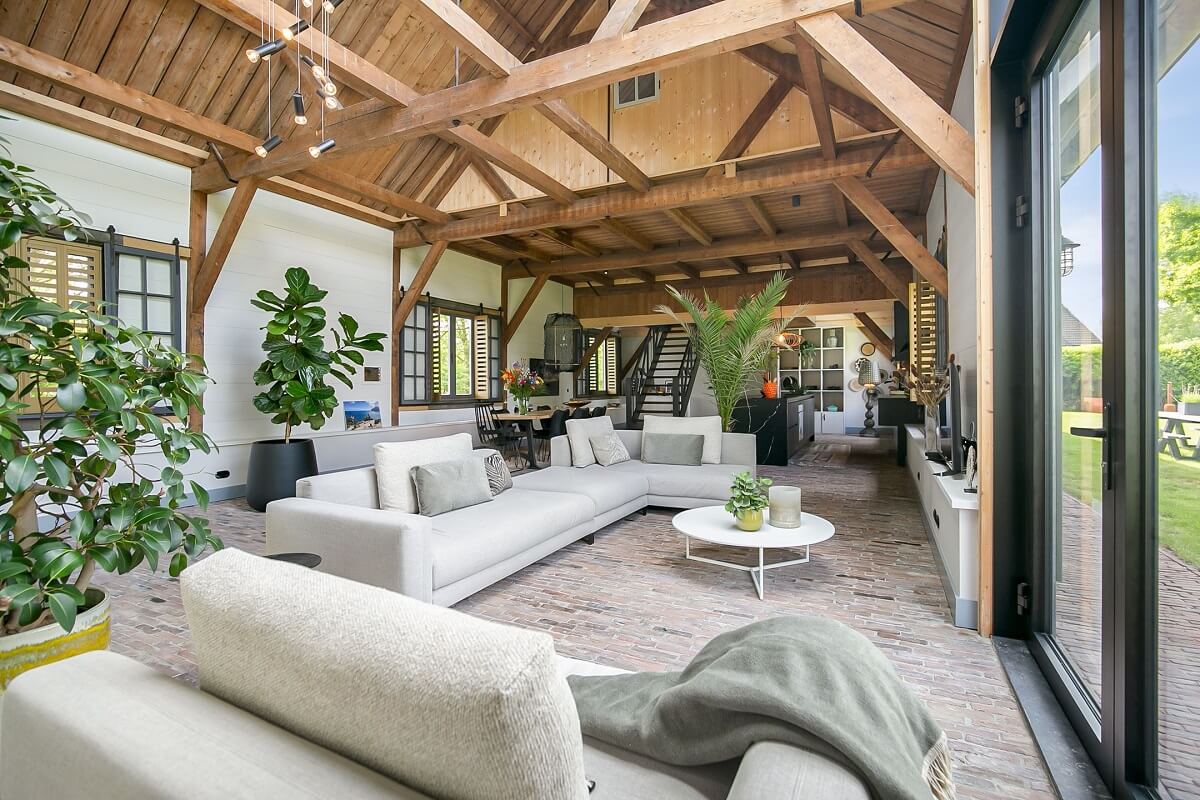 living-room-plants-brick-floor-wooden-ceiling-nordroom