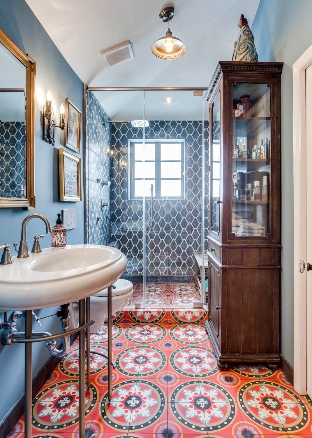bathroom-orange-moroccon-floor-tiles-blue-walls-shower-nordroom