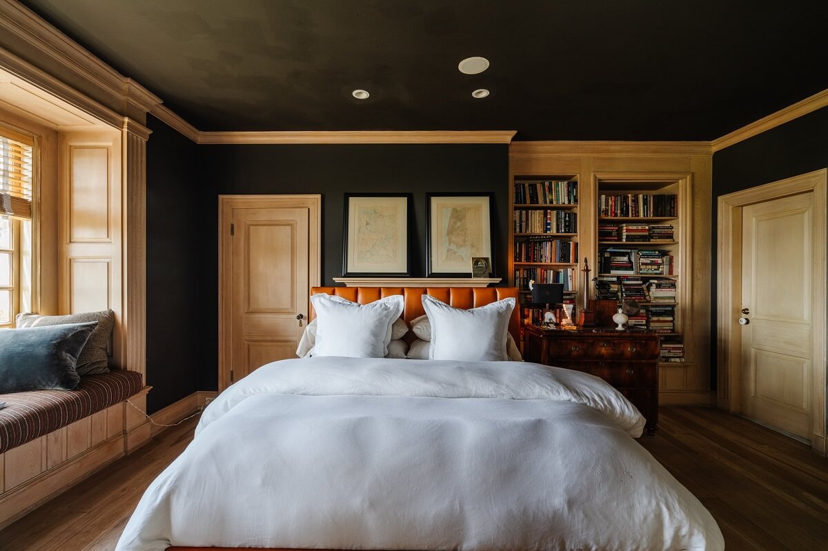 bedroom-leather-headboard-black-ceiling-window-seat-nordroom