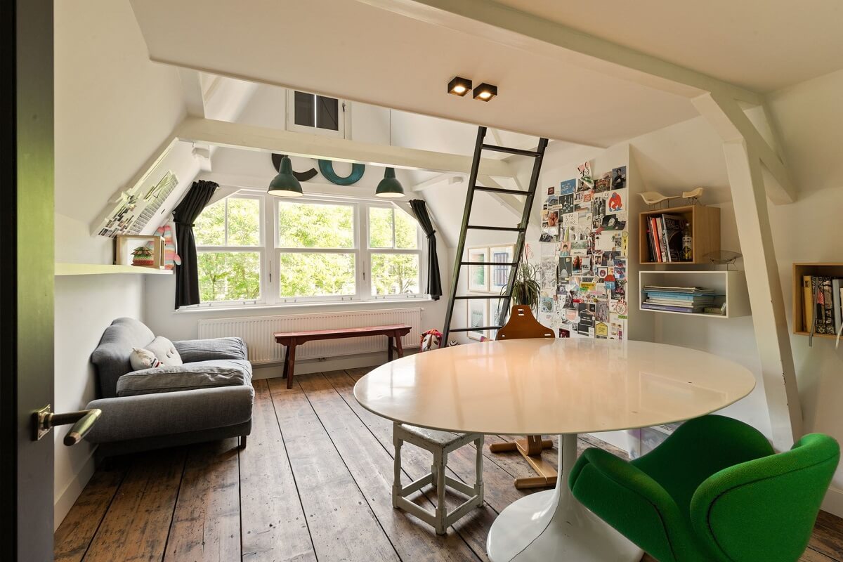 bedroom-loft-bed-round-table-slanted-ceiling