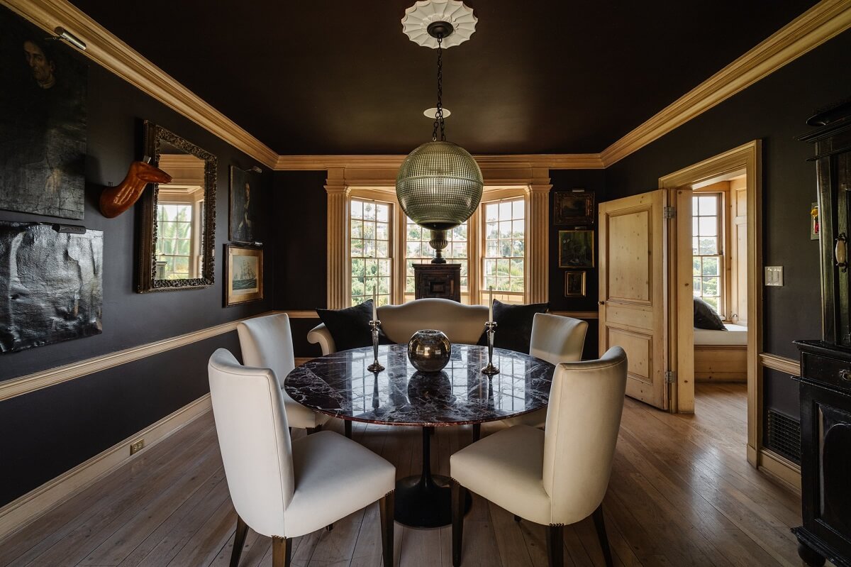 black-walls-ceiling-dining-room-with-round-dining-table-nordroom