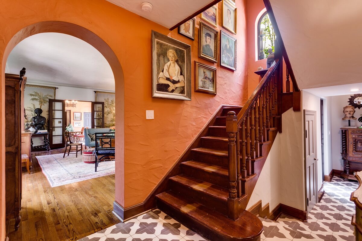 hallway-orange-wall-floorvtiles-wooden-staircase-nordroom
