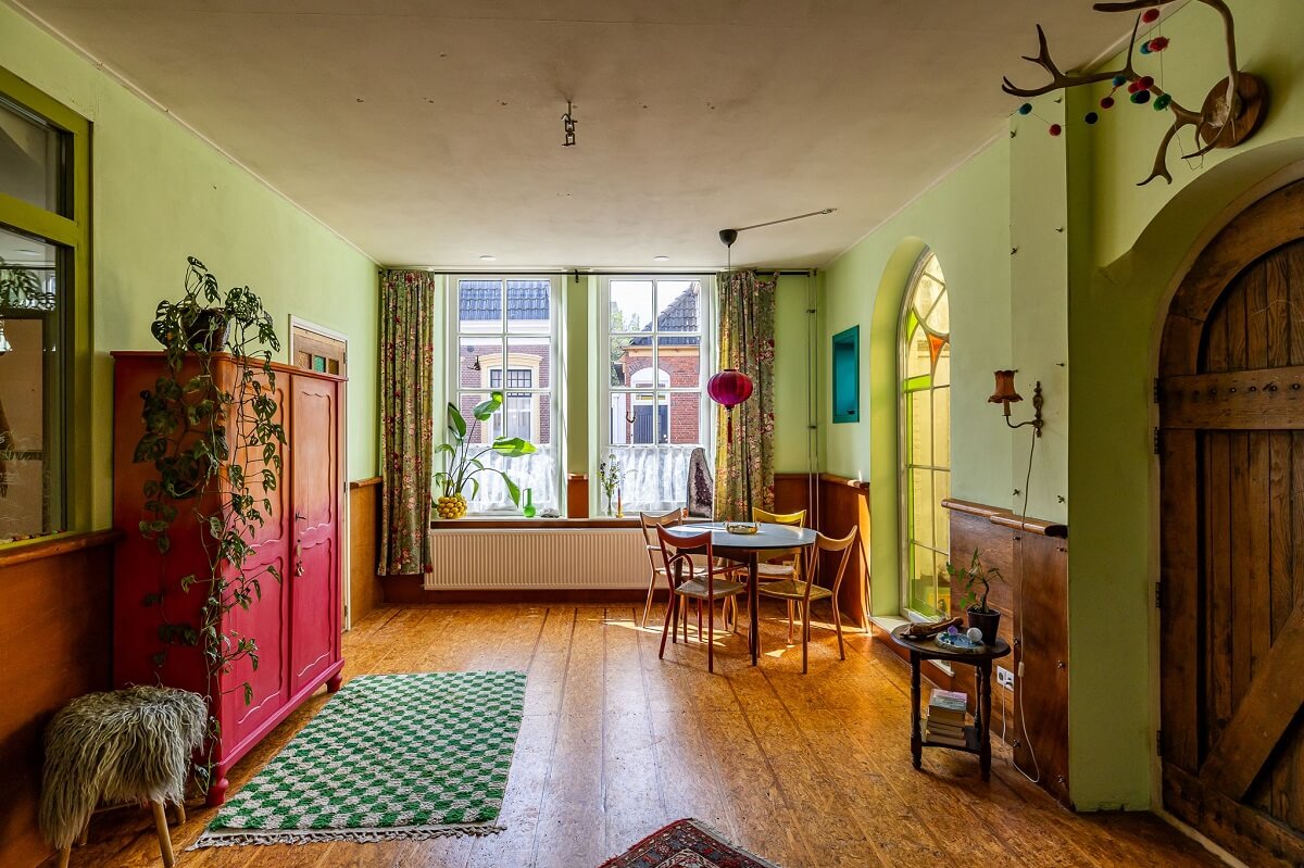 living-room-wooden-floorboards-green-walls-nordroom