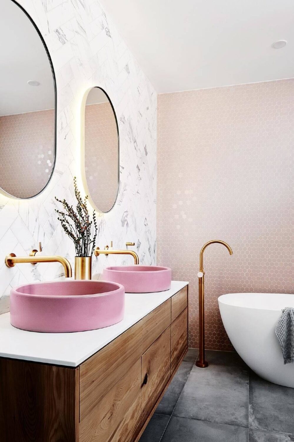 modern-bathroom-pink-walls-round-sinks-nordroom