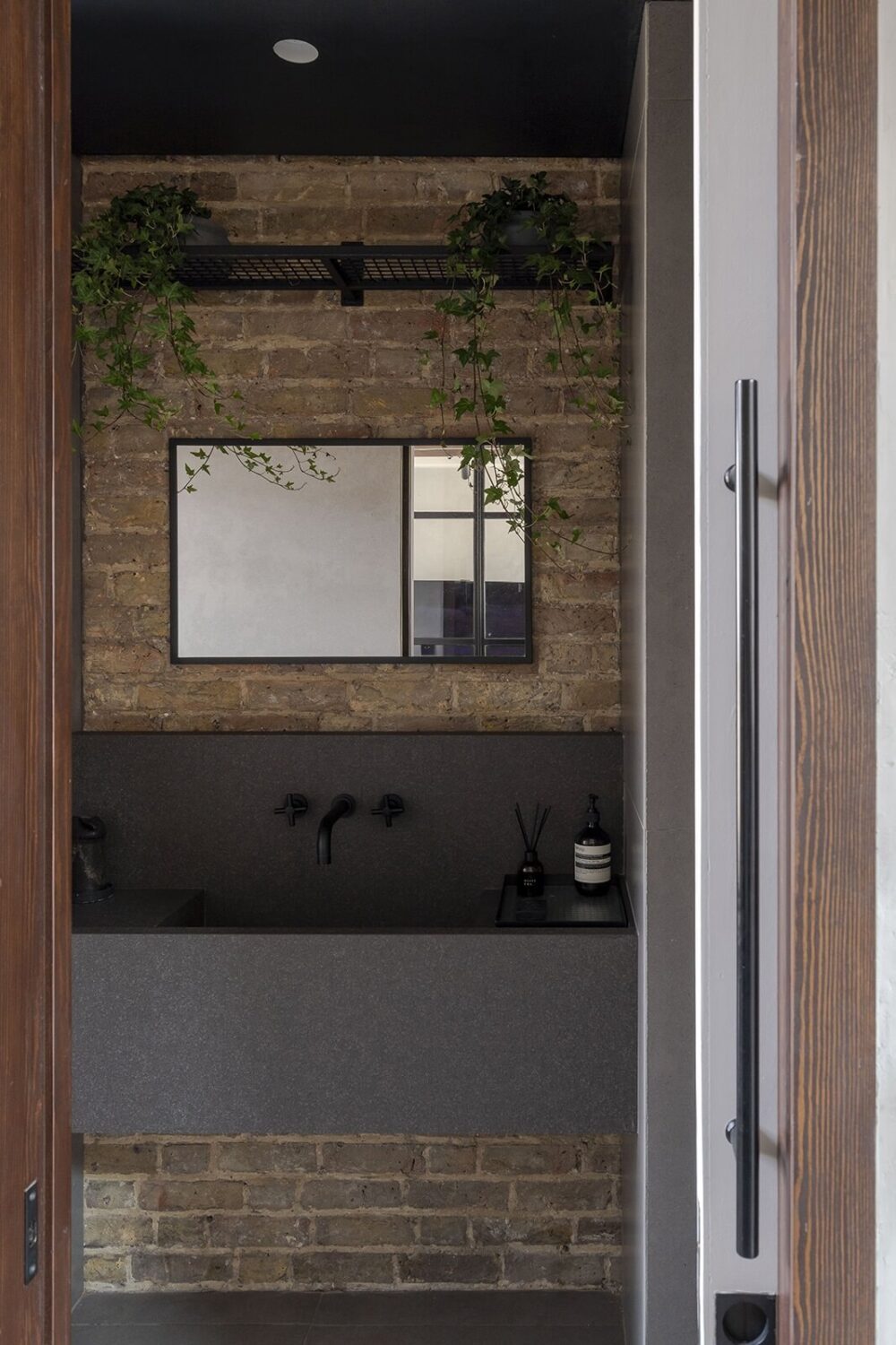 powder-room-brick-wall-modern-gray-sink-nordroom