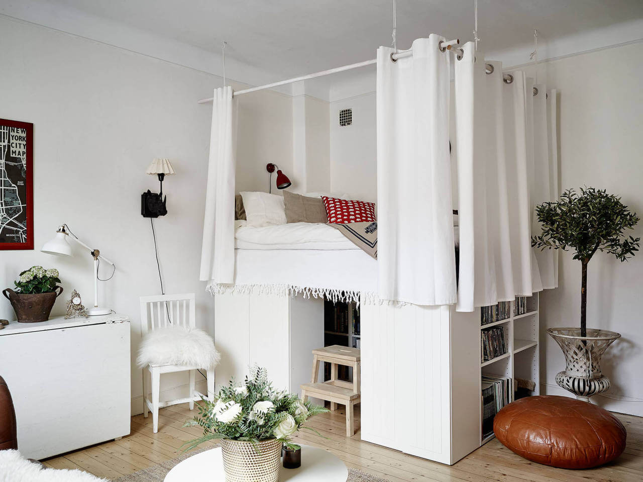 raised-loft-bed-storage-bookshelves-curtain-around-bed-nordroom