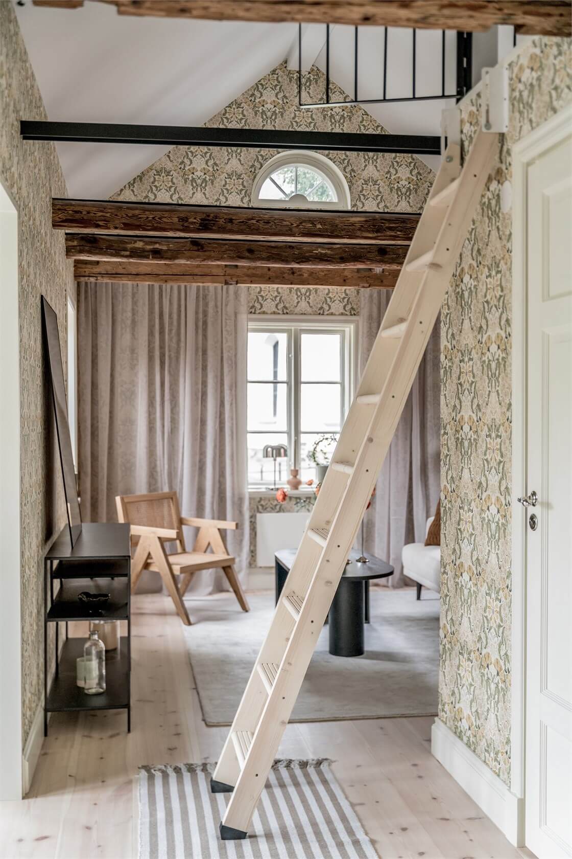 https://www.thenordroom.com/wp-content/uploads/2023/07/stairs-to-sleeping-loft-small-home-sweden-nordroom.jpg