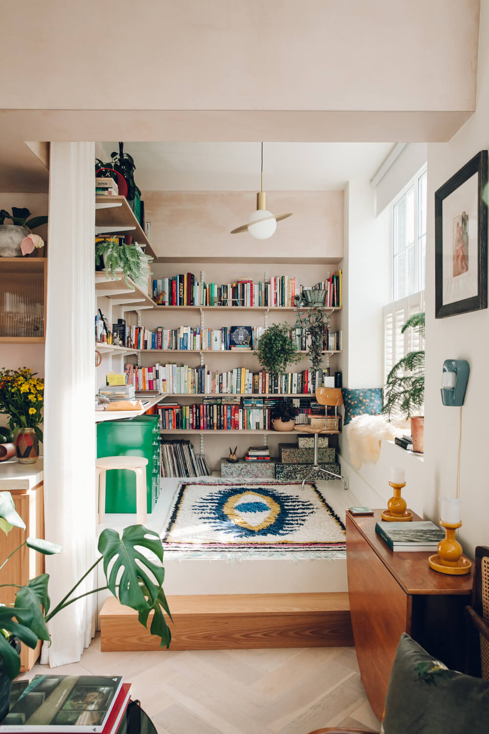 studio-apartment-bookshelves-raised-platform-curtain-divider-nordroom
