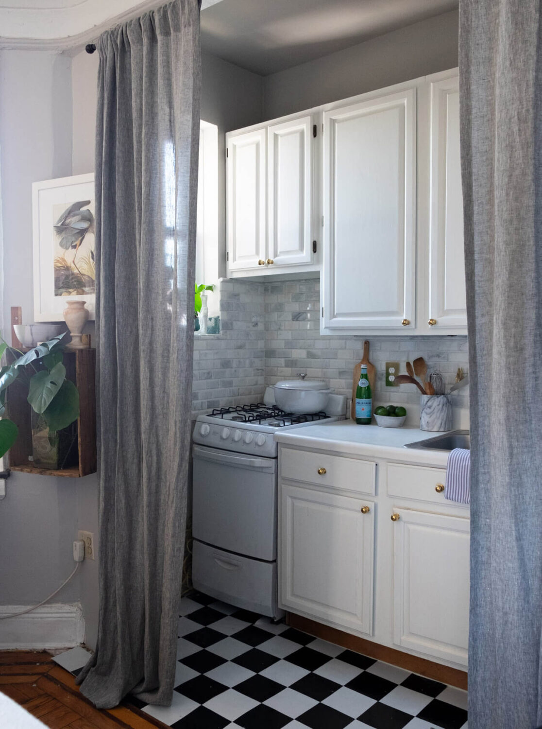 tiny-studio-gray-curtain-hides-kitchen-nordroom