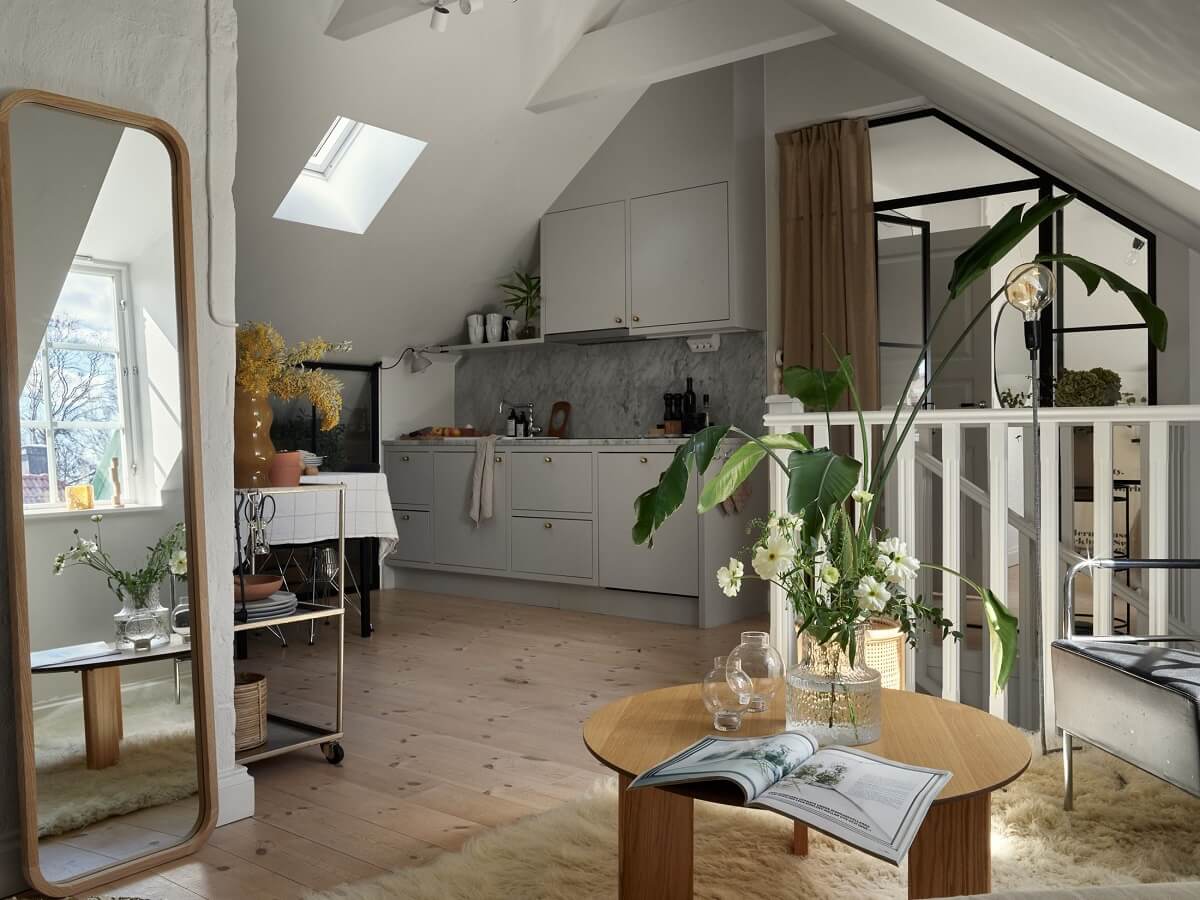 A Small Attic Apartment with Industrial Glass walls