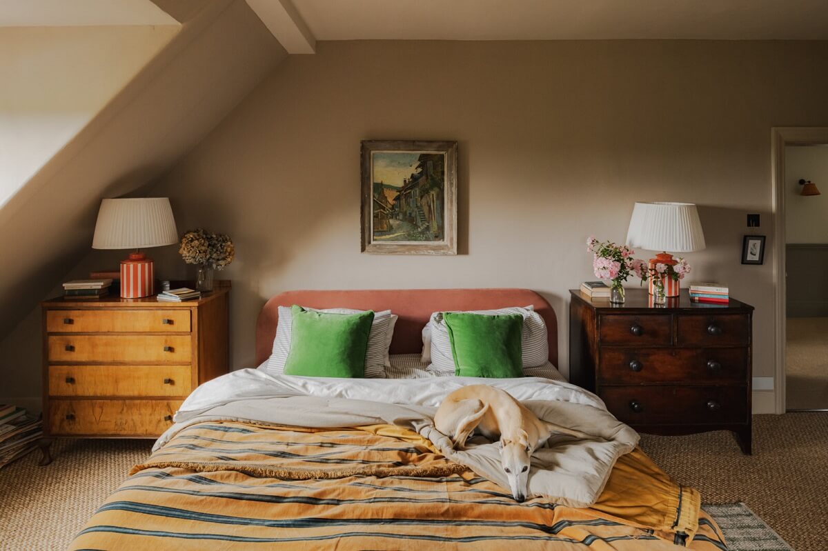 bedroom-gray-walls-slanted-ceiling-pink-headboard-nordroom