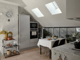 A Small Attic Apartment with Industrial Glass walls - The Nordroom - Effective Use Of Skylights In Industrial Apartment Design