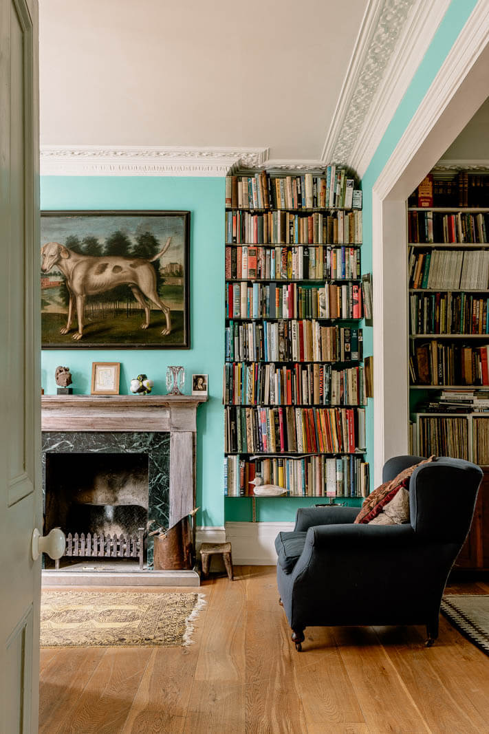 historic-living-room-fresh-blue-walls-books-nordroom