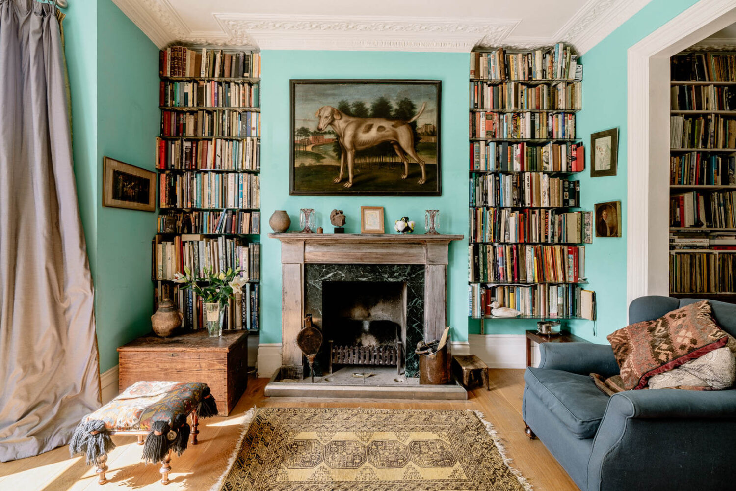 living-room-fresh-blue-walls-bookshelves-nordroom