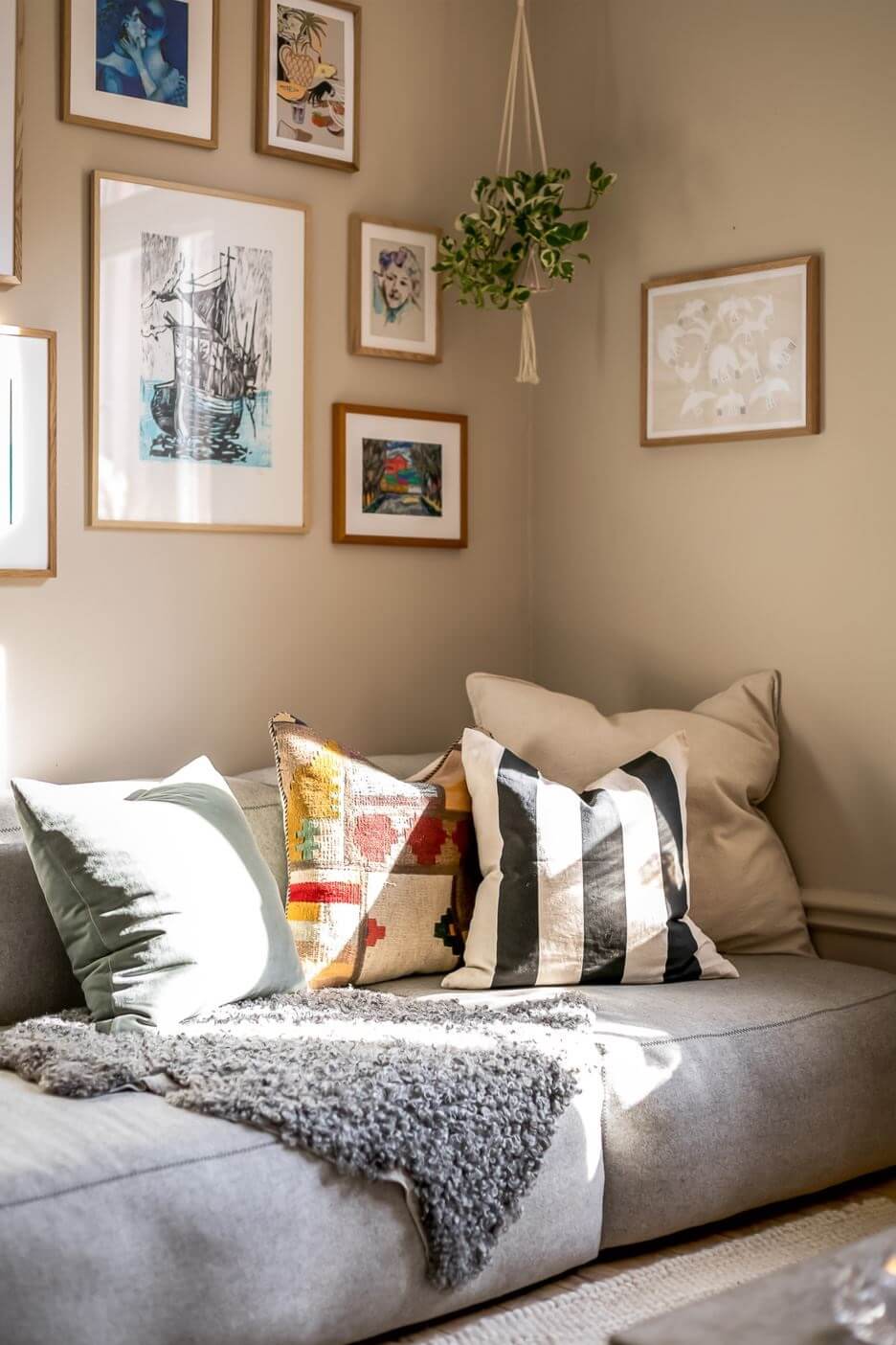 living-room-sofa-hanging-plant-beige-walls-nordroom