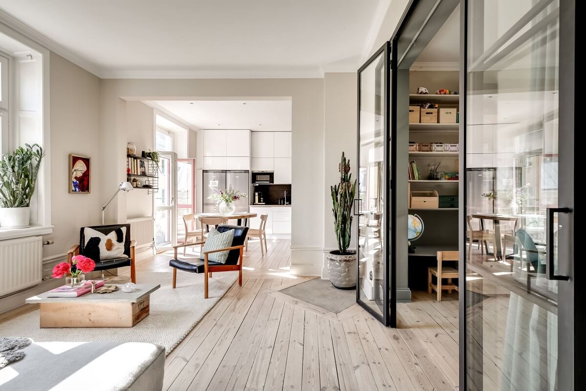 open-plan-living-space-wooden-floor-industrial-glass-doors-nordroom