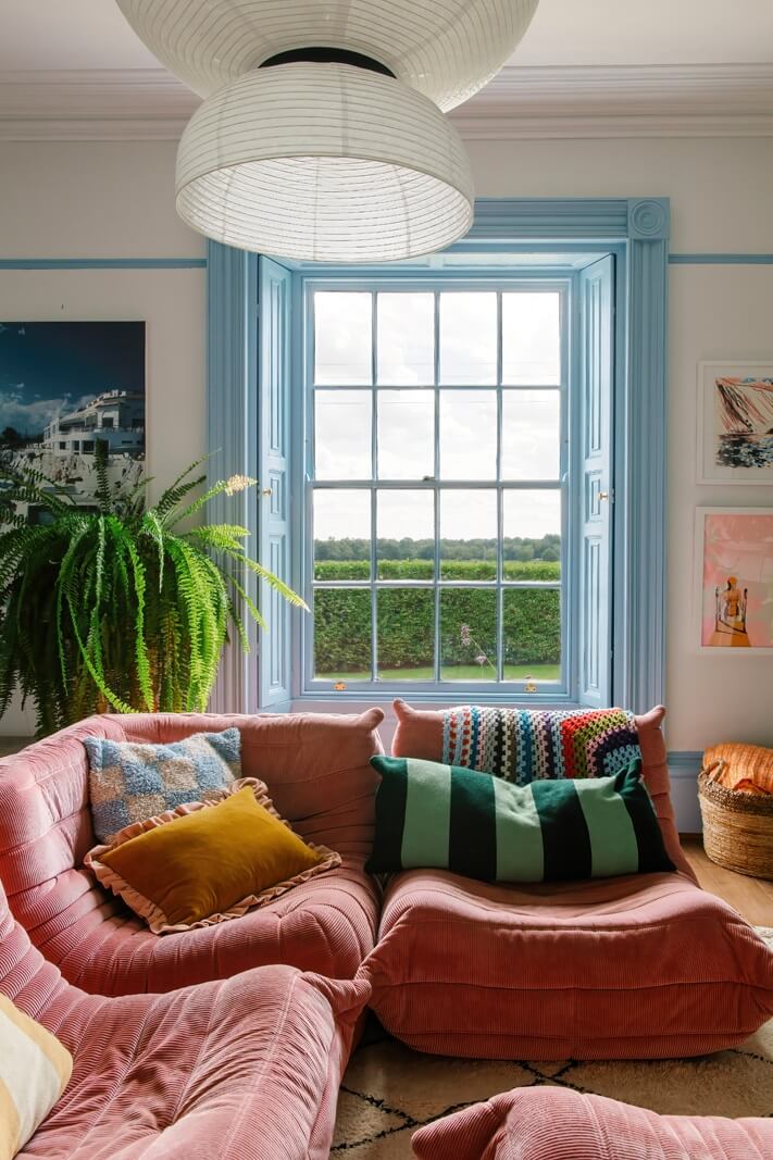 pink-togo-sofa-blue-window-frames-nordroom