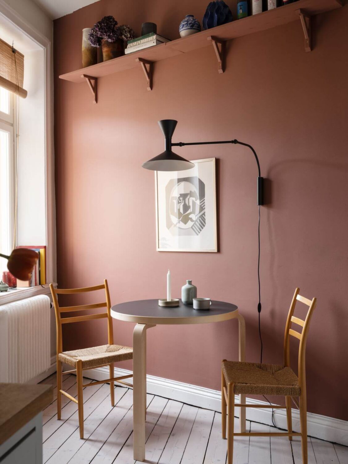 pink-wall-with-shelf-small-round-dining-table-nordroom