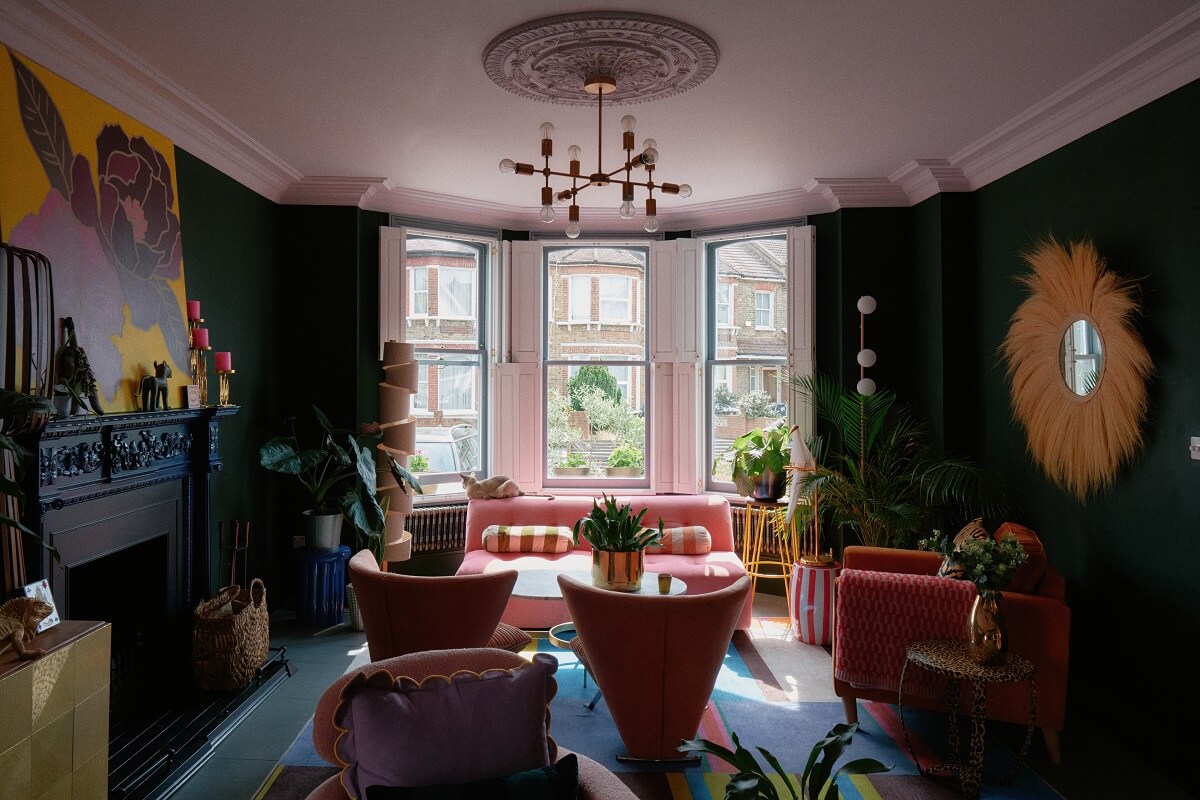 colorful-living-room-green-walls-bay-window-nordroom