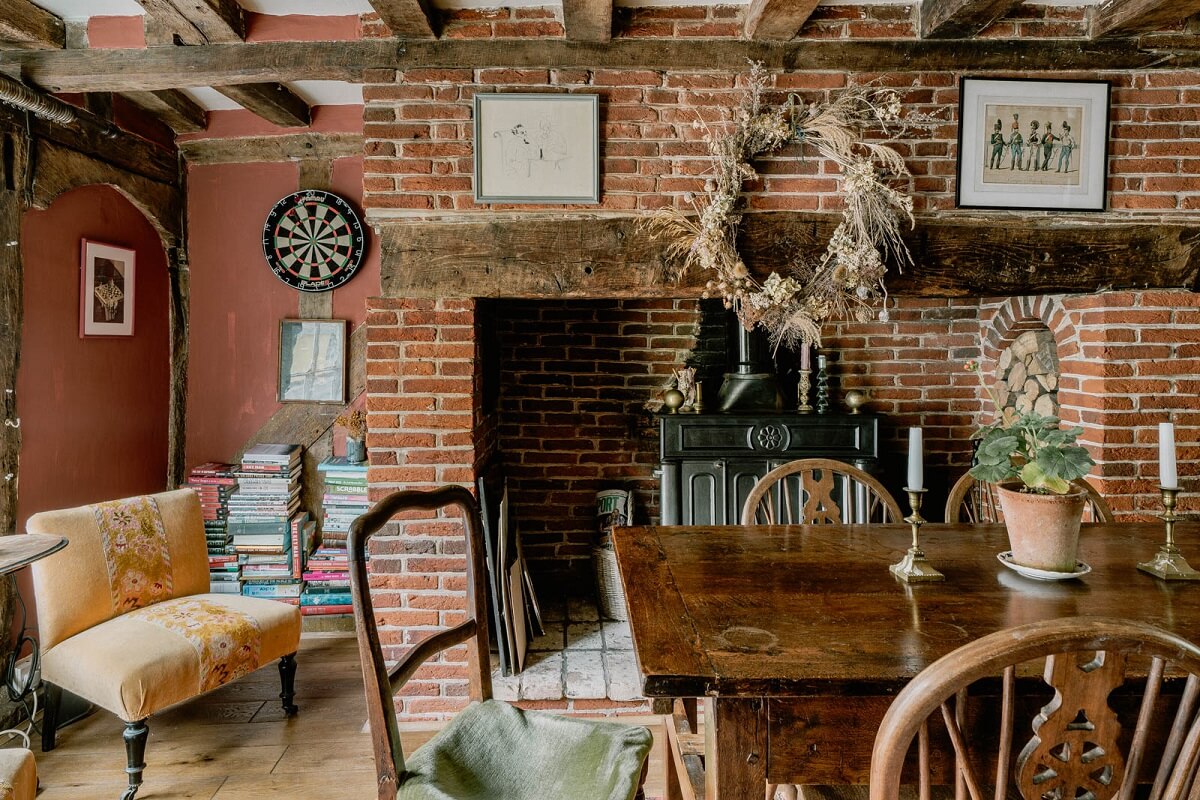dining-room-exposed-beams-brick-walls-wooden-table-nordroom