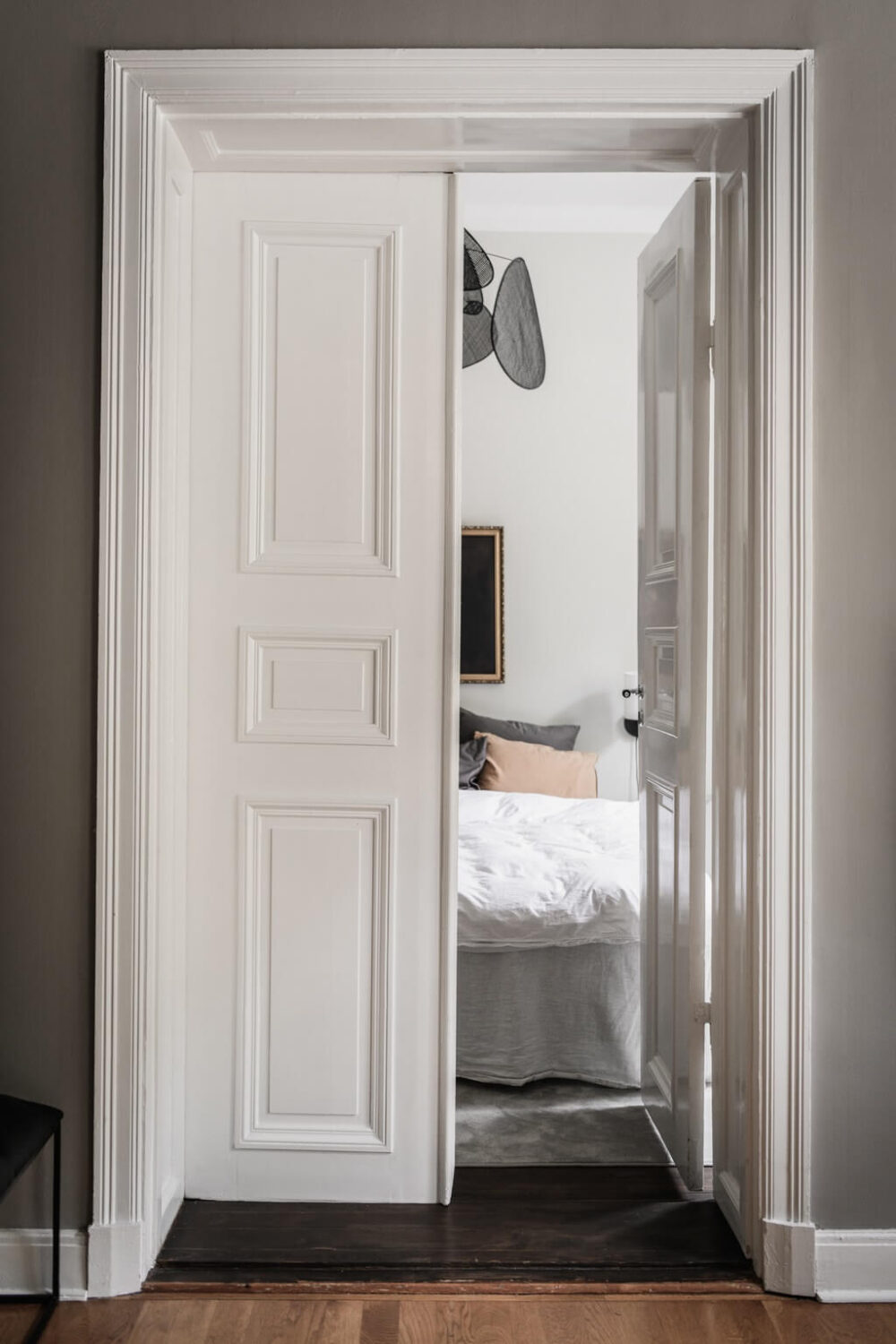 double-doors-bedroom-gray-scandinavian-apartment-nordroom