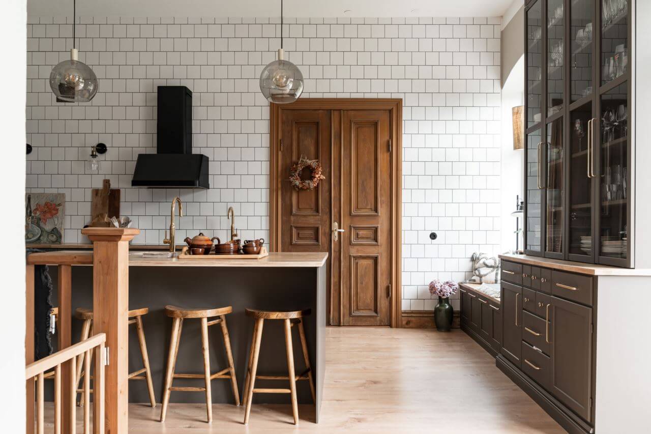 gray-kitchen-wooden-double-doors-floor-to-ceiling-tiled-wall-nordroom