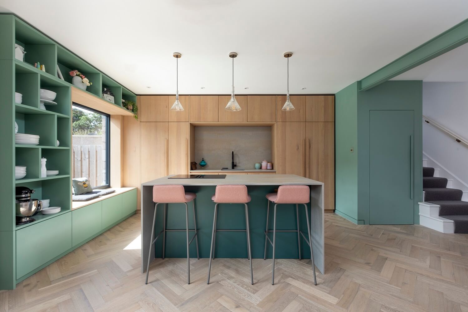 green-kitchen-island-open-cabinets-window-seat-agora-nordroom