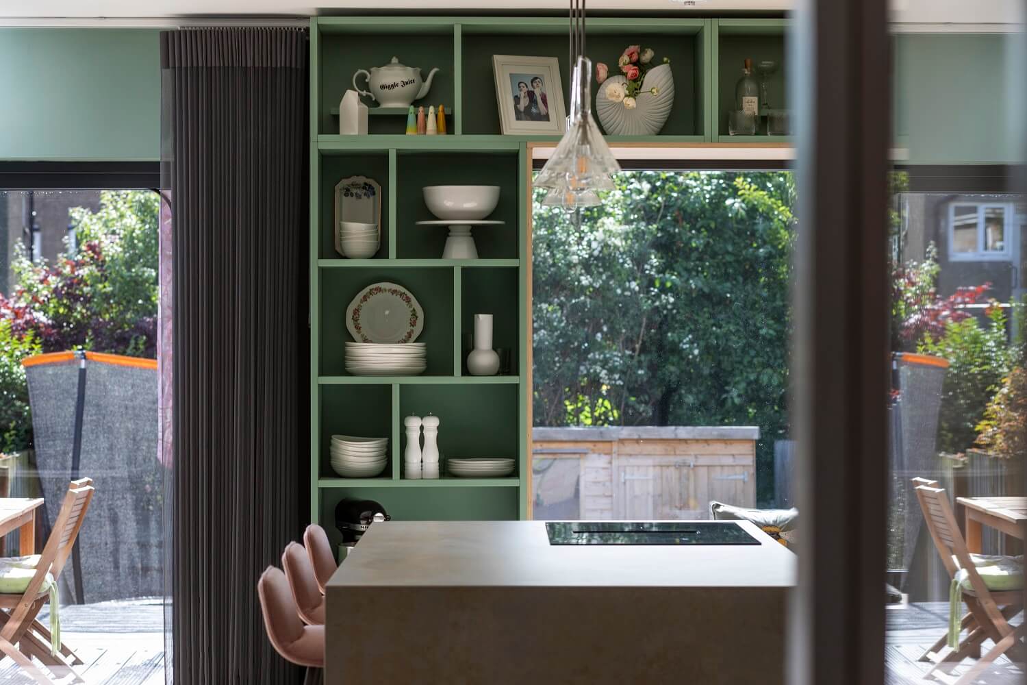 green-open-cabinets-around-window-agora-architecture-design-nordroom