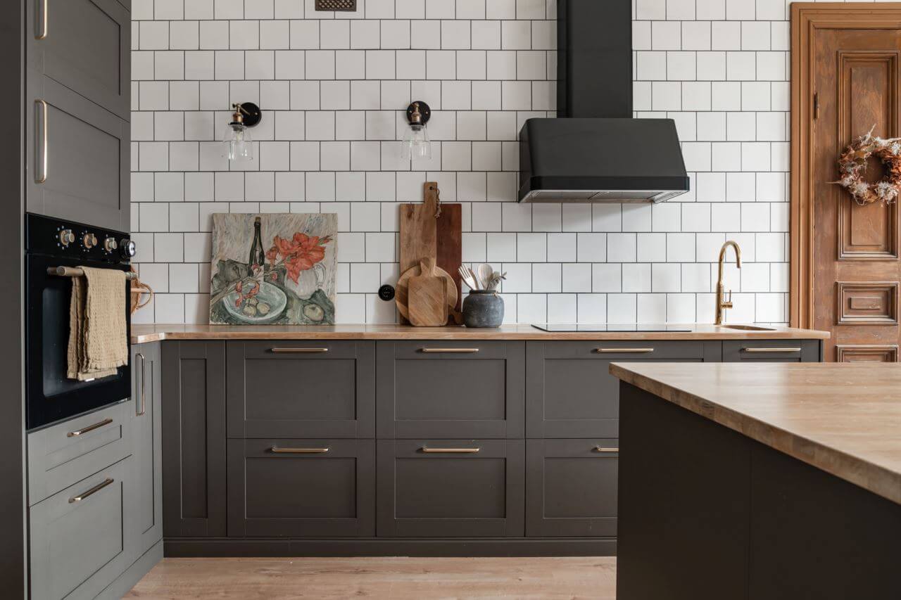 kitchen-gray-cabinets-tiled-wall-nordroom